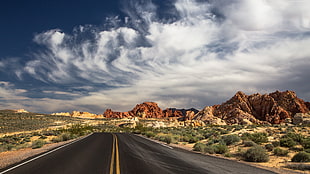 photo of roadway toward mountains during daytime HD wallpaper