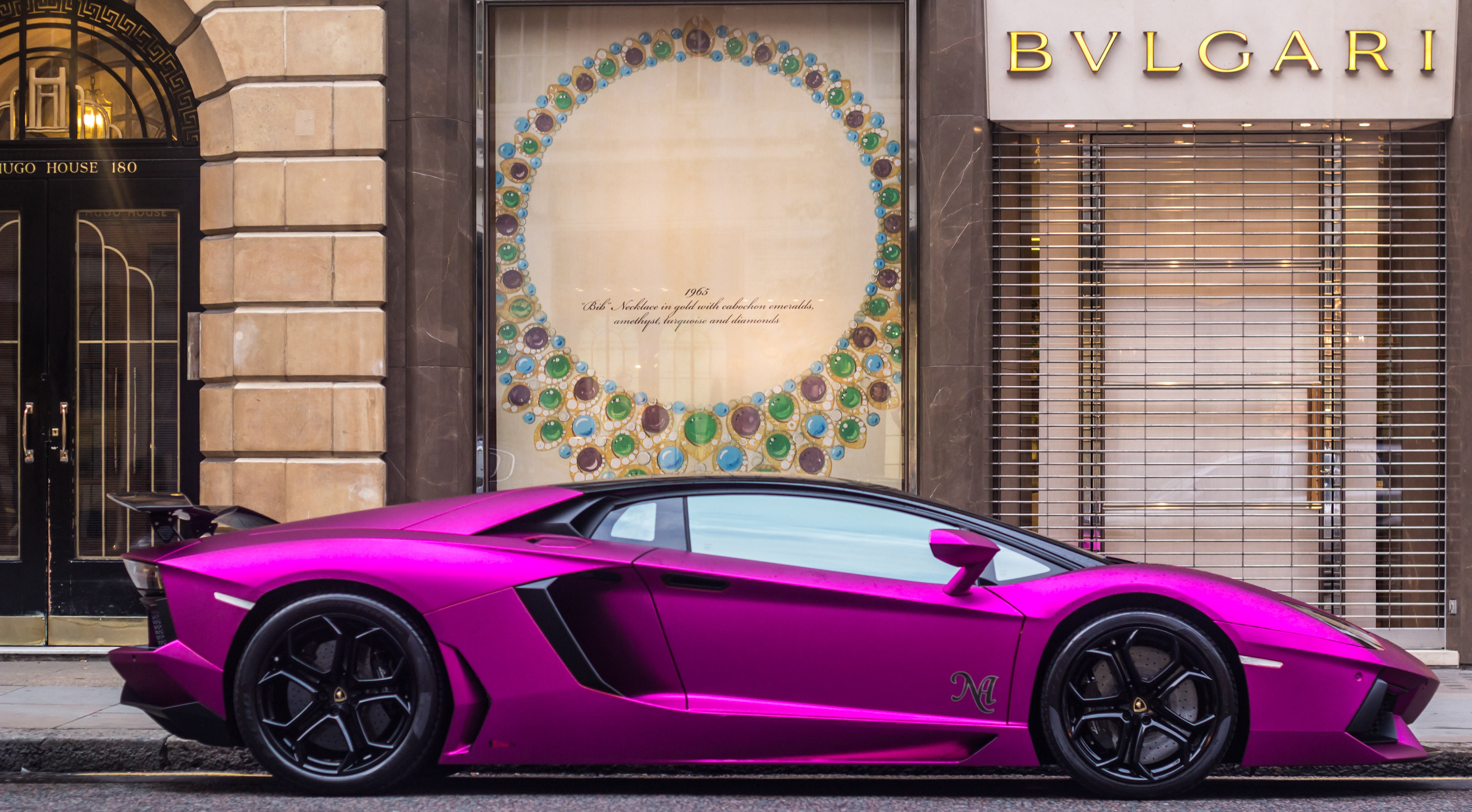 purple sports car near Bvlgari store