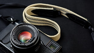 black leather Salvatore Ferragamo belt, camera