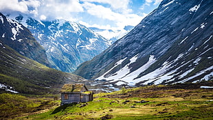 house surrounded with mountains HD wallpaper
