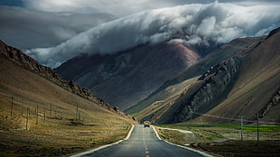 black road between brown mountain, road, mountains, clouds