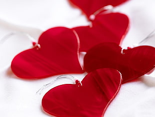 two pairs of red heart earrings HD wallpaper