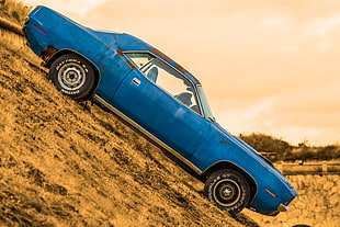 classic blue coupe on brown soil during daytime HD wallpaper