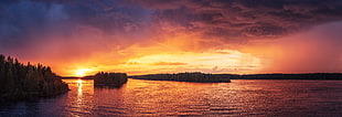 panoramic and silhouette photography of sea and mountains