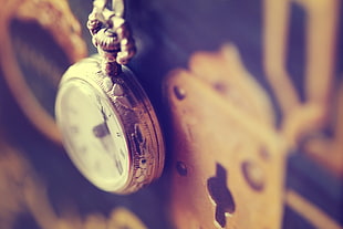 silver-colored pocket watch