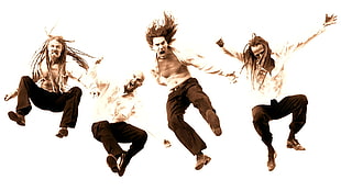 four men jumping during daytime
