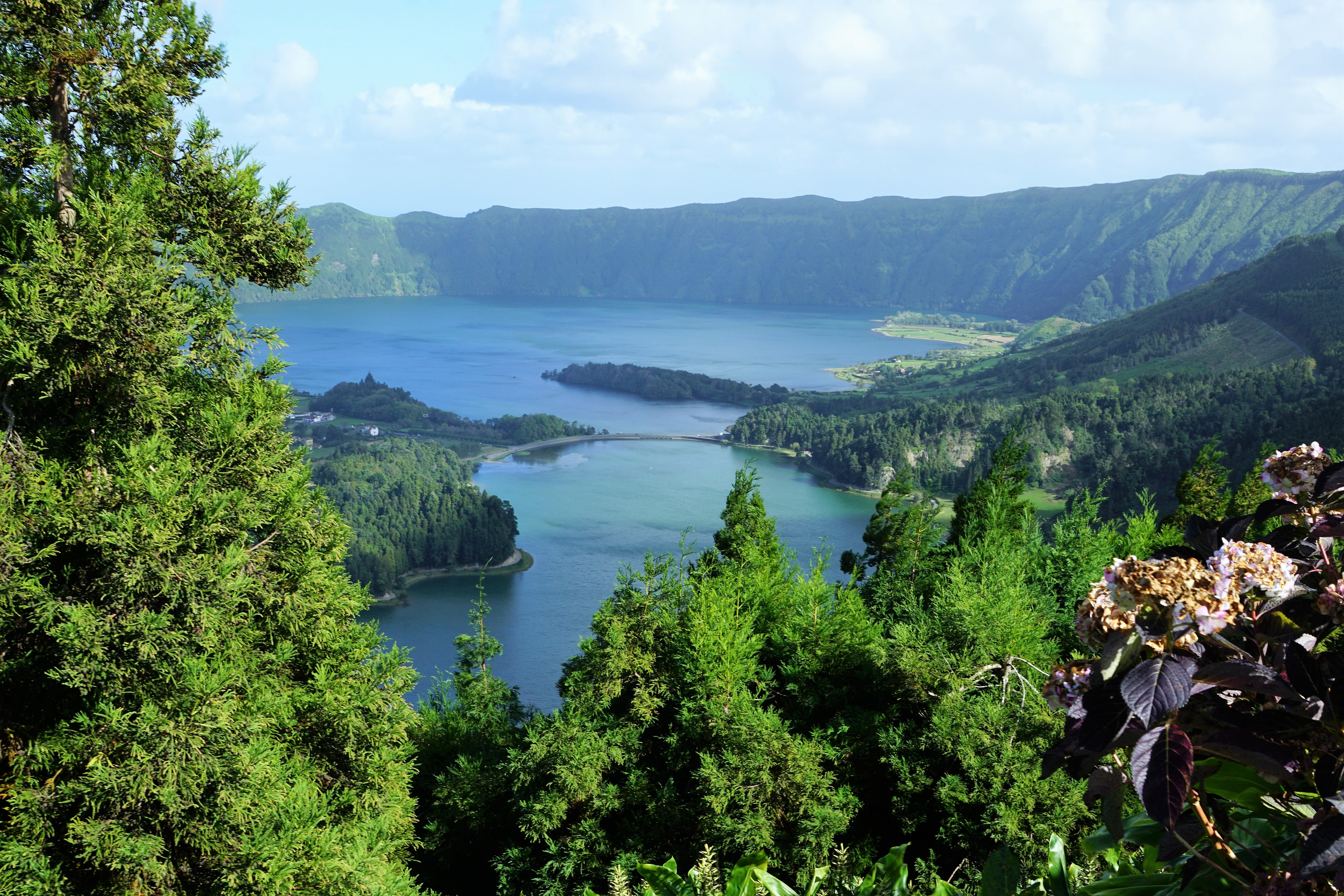 aerial view of lake in between mountains at daytime