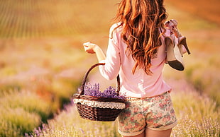 woman carrying brown basket while walking on grass HD wallpaper