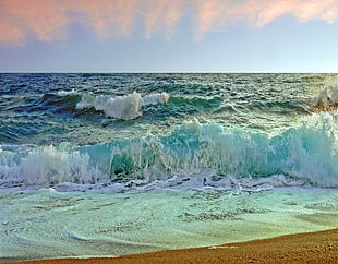 photo of blue and white tidal wave of sea