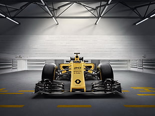 yellow and black formula 1 race car on gray surface