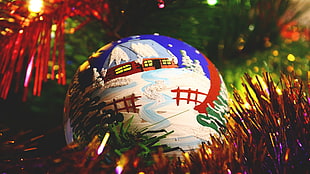 closeup photo of blue, white, and red printed bauble