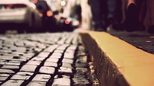 yellow concrete pavement, depth of field, city, car, street