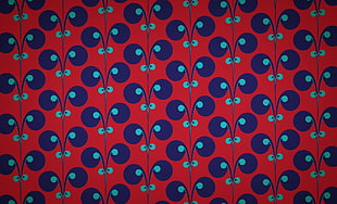 blue and red monogram textile