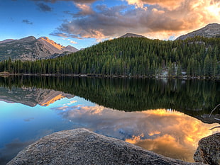 lake near trees and mountain photography