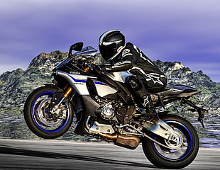 man in black Alpine star motorcycle suit riding blue and black Yamaha sport bike