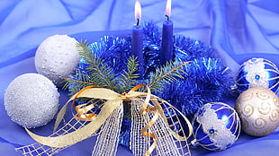 two blue candle with lights