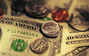 shallow focus photography of coins on U.S dollar bills HD wallpaper