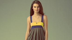 woman in gray, yellow, and blue sweetheart neck sleeveless dress