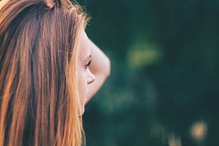 woman holding her hair closeup photography HD wallpaper