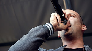man holding black microphone