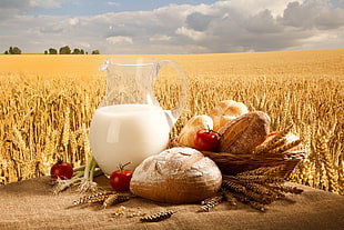 clear glass pitcher with breads on tray