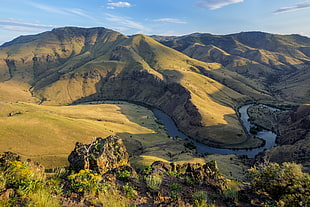 aerial photo of green rock formation with trees photo, deschutes river