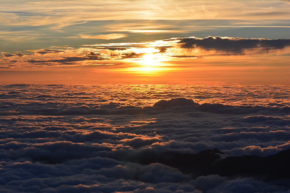 aerial view of sea of clouds during golden hour HD wallpaper